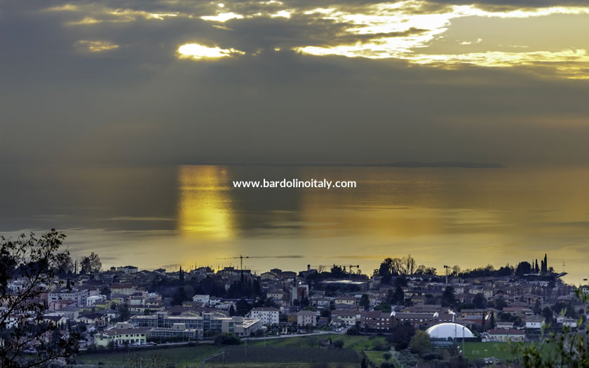 Light over the water of Lake Garda and the town of Bardolino